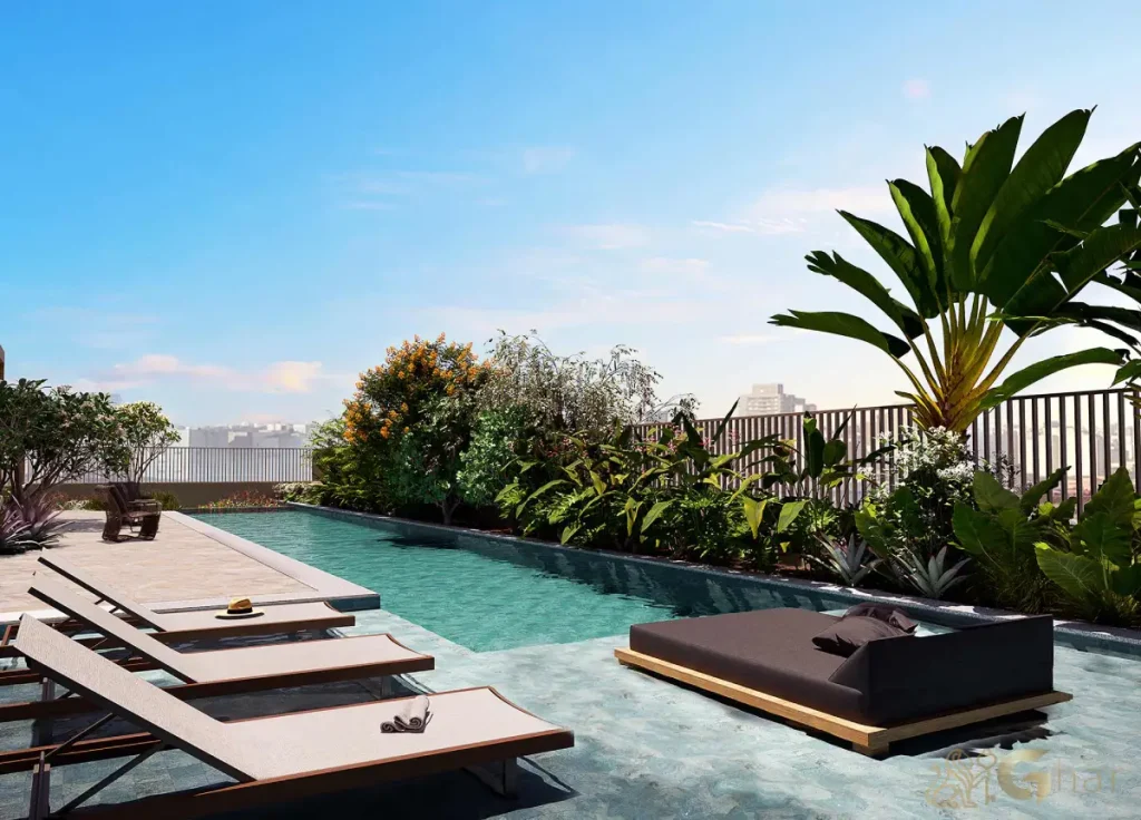 Piscina com deck molhado no condomínio Emiie Moema Residencial