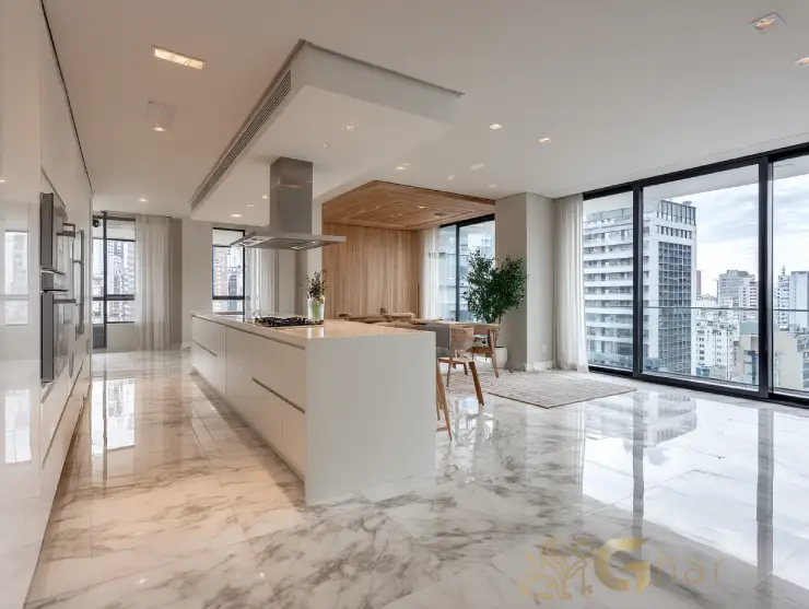 Cozinha aberta e ilha integrada à sala de jantar em imóvel na zona leste da capital paulista