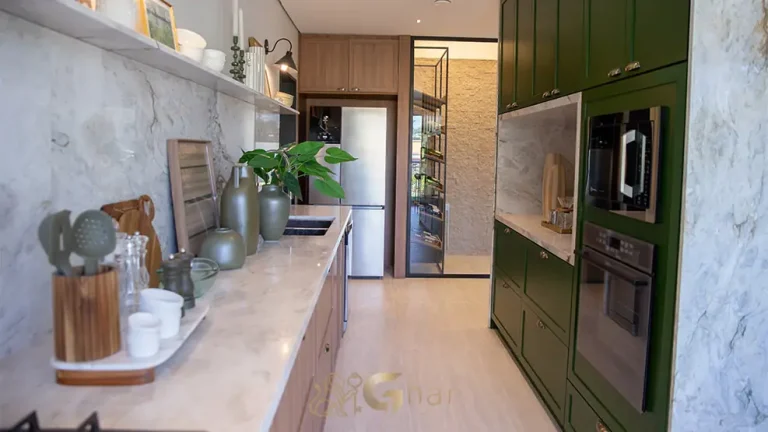 Cozinha integrada ao living em apartamentos na Cidade Jardim, São Paulo