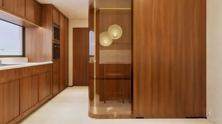 Cozinha com bancada em ilha do apartamento decorado do condomínio Maison Gabrielle no bairro de Moema, São Paulo