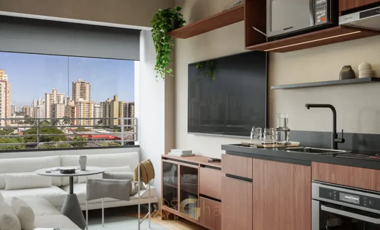 Cozinha do apartamento decorado com bancada de granito do condomínio Zenion no bairro da Vila Olímpia, São Paulo