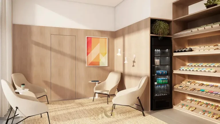 Lounge com mini mercado do condomínio EMIIE Studios no bairro de Moema, São Paulo